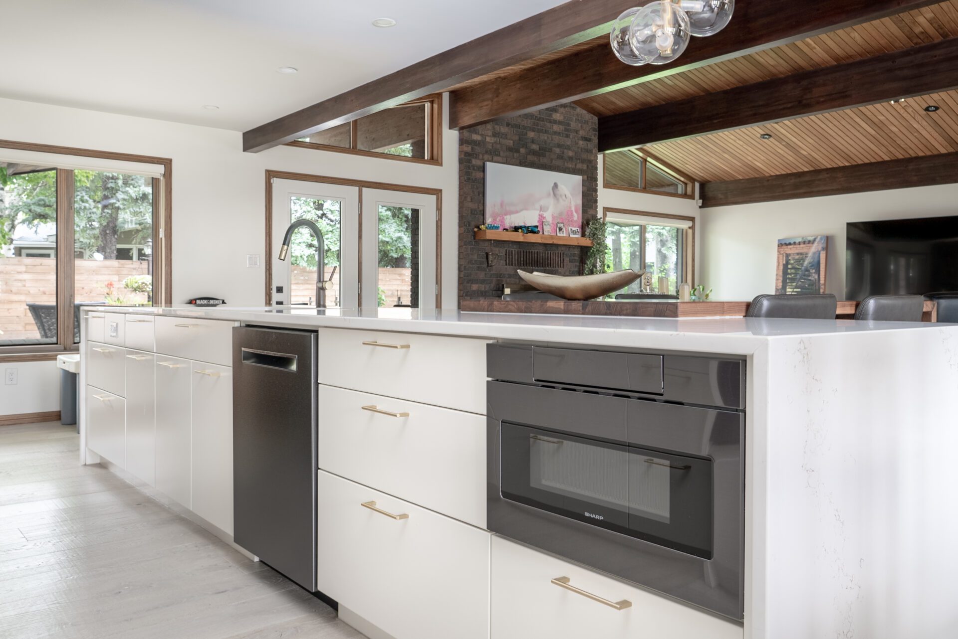 a kitchen with hardwood floors and a dining table